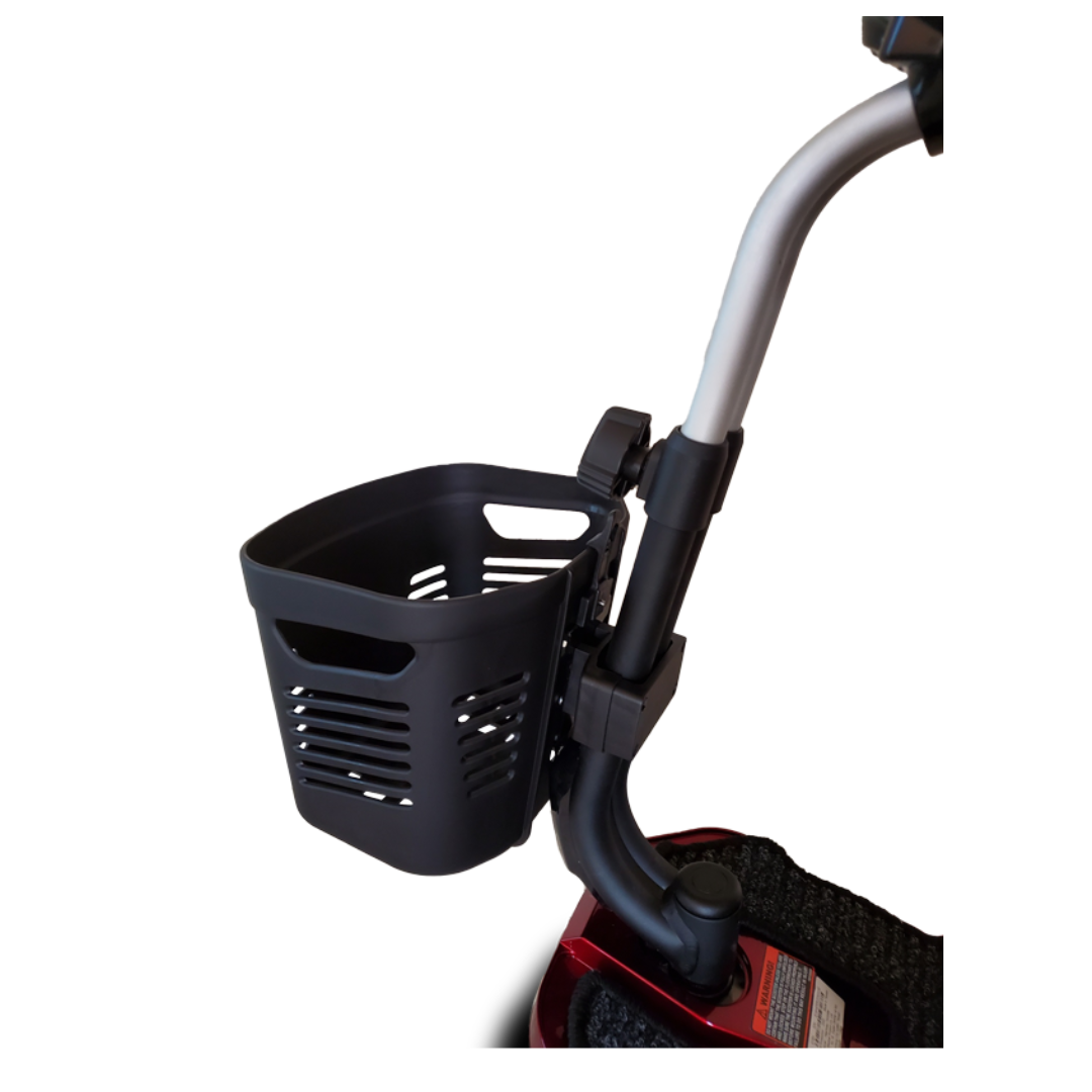 A close-up of the EV Rider Front Scooter Basket, a black plastic basket mounted on mobility scooter handlebars, featuring a curved silver support and a partially visible red base.